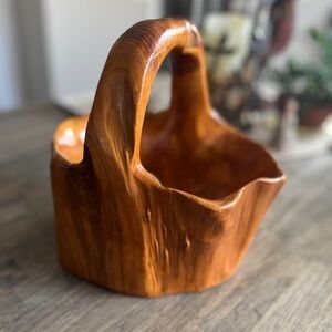 Hand carved wood bowl made from single block of wood.